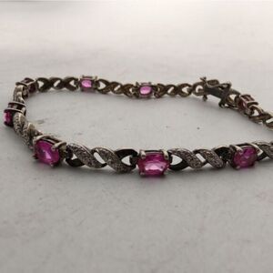Beautiful vintage‎ sterling silver bracelet with pink tanzanite stones.